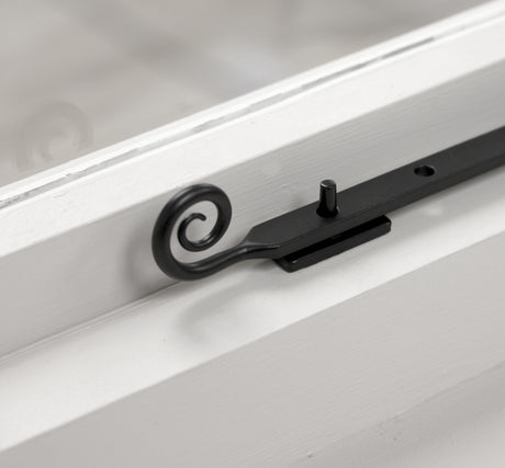 Image showing a smooth matt black casement stay from Stonebridge.  Available to order from Trade Door Handles