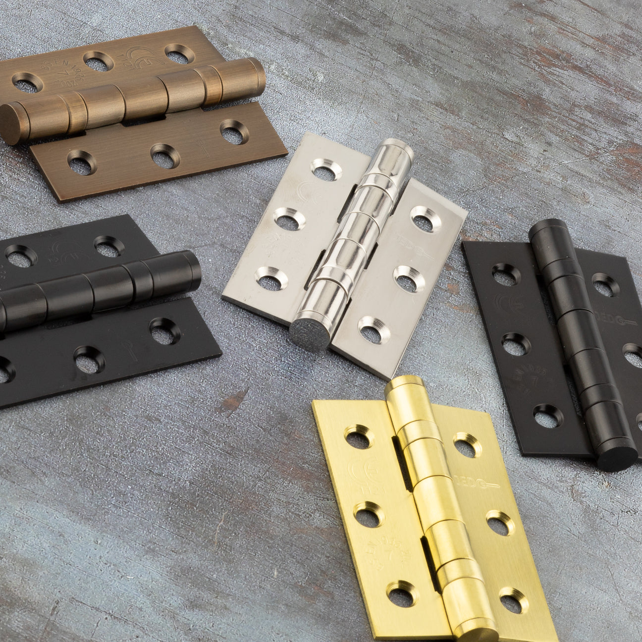 Image showing a range of 4 inch ball bearing hinges in various finishes made by Frelan Hardware.  Available to order from Trade Door Handles in Kendal
