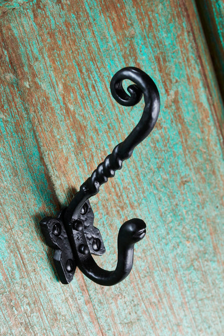 Image shows a traditional hat and coat hook in antique black by Ludlow Foundries.  Available to order from Trade Door Handles
