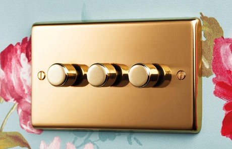 Image showing a three gang dimmer light switch in brass by EuroLite