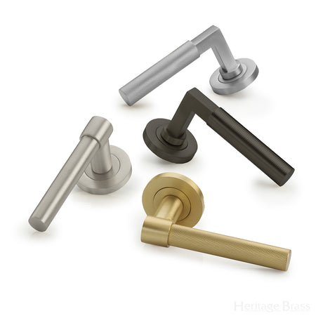 Image showing four door handles by Heritage Brass in various finishes.  Available to order from Trade Door Handles in Kendal