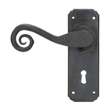 This image shows the From The Anvil Lever Lock Beeswax Door Handles 33900.  Available to order From Trade Door Handles in Kendal