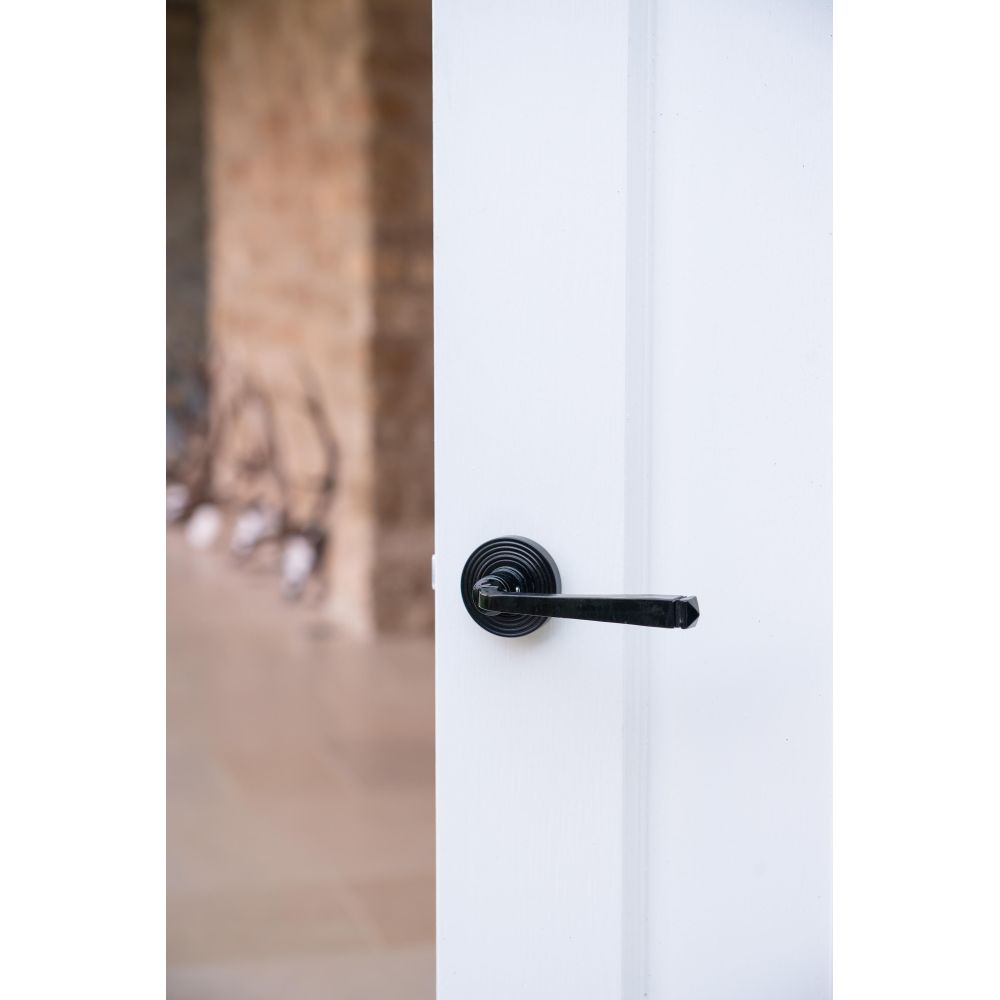 From The Anvil - Black Avon Round Lever on Rose Set (Beehive) | Sku. 45625 | Trade Door Handles.
