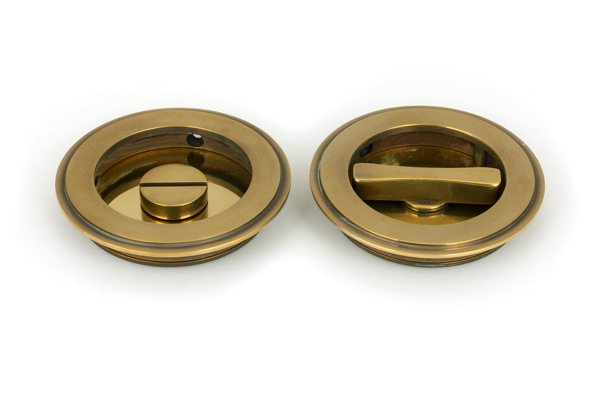From The Anvil - Aged Brass 75mm Art Deco Round Pull - Privacy Set | Sku. 48325 | Trade Door Handles.