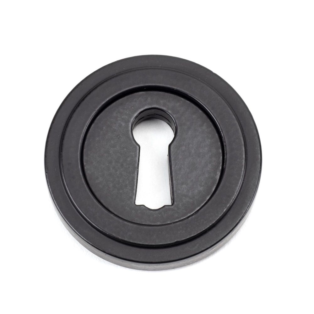 From The Anvil - Matt Black Round Escutcheon (Art Deco) | Sku. 49537 | Trade Door Handles.