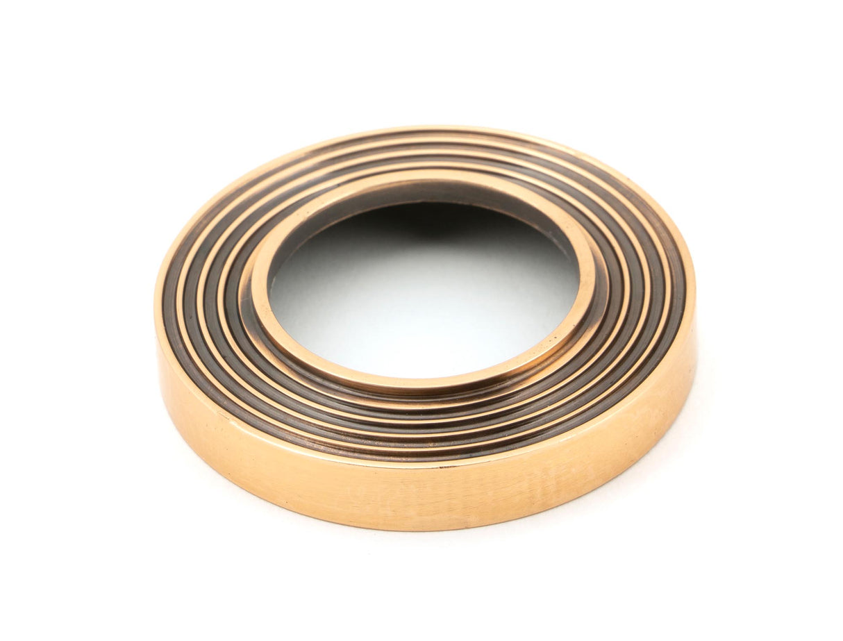 From The Anvil - Polished Bronze Avon Round Lever on Rose Set (Beehive) - Unsprung | Sku. 50063 | Trade Door Handles.