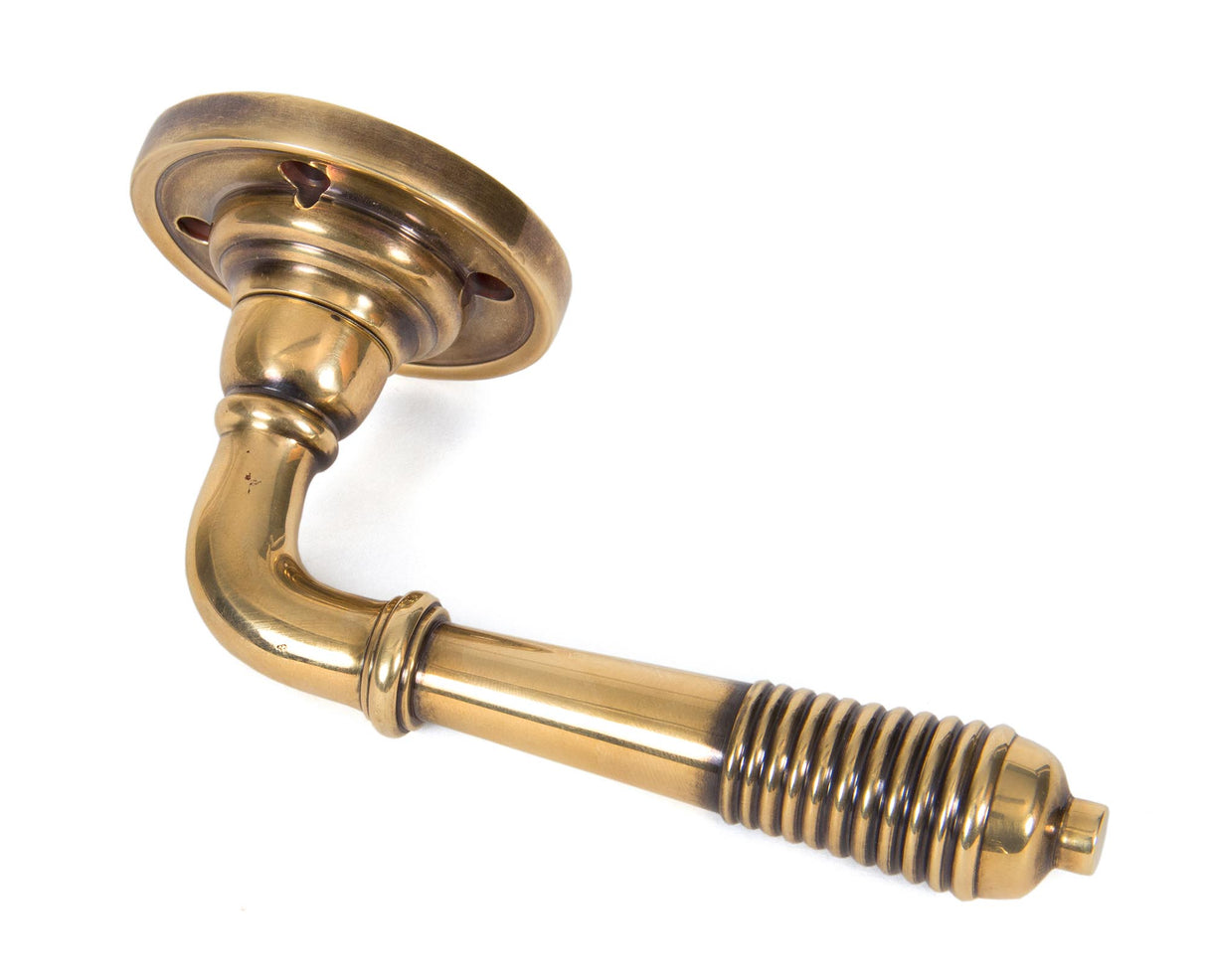 From The Anvil - Aged Brass Reeded Lever on Rose Set - Unsprung | Sku. 50086 | Trade Door Handles.