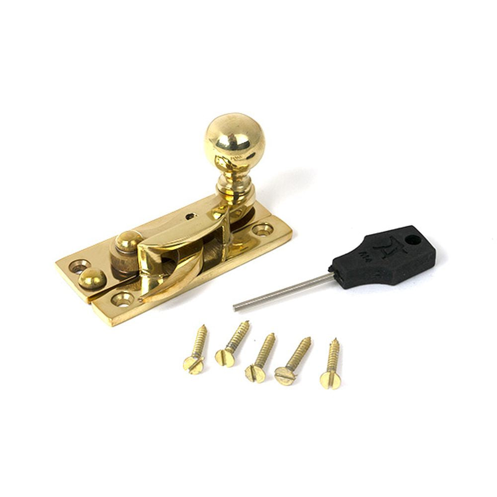 High quality images of the From The Anvil - Polished Brass Sash Hook Fastener | Sku. Anvil-52369 | available to order from Trade Door Handles, quick delivery at discounted prices.