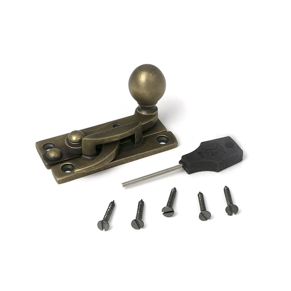 High quality images of the From The Anvil - Burnished Brass Sash Hook Fastener | Sku. Anvil-52376 | available to order from Trade Door Handles, quick delivery at discounted prices.