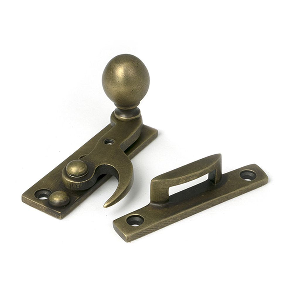 High quality images of the From The Anvil - Burnished Brass Sash Hook Fastener | Sku. Anvil-52376 | available to order from Trade Door Handles, quick delivery at discounted prices.