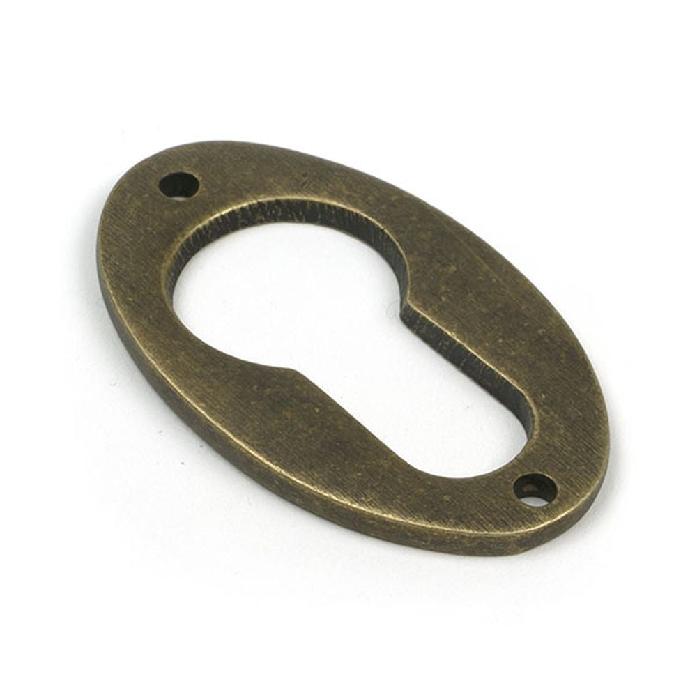 High quality images of the From The Anvil - Burnished Brass Oval Euro Escutcheon | Sku. Anvil-52457 | available to order from Trade Door Handles, quick delivery at discounted prices.