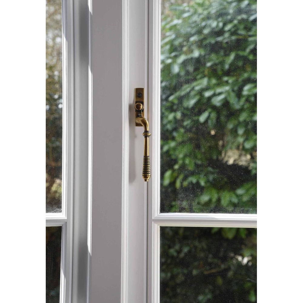 From The Anvil - Aged Brass Reeded Espag - RH | Sku. 83915 | Trade Door Handles.