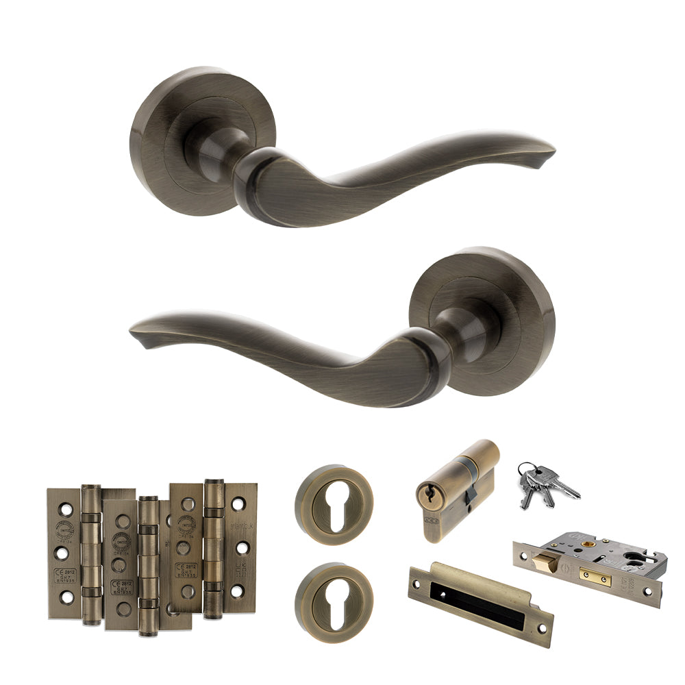 Quality image of Old English Warwick Door Handle Pack (Euro Lock Set - 2.5" CE Sashlock, 3" Fire Rated Hinges x3) - Antique Brass | Sku. adpoe178ab20 | available from Trade Door Handles.
