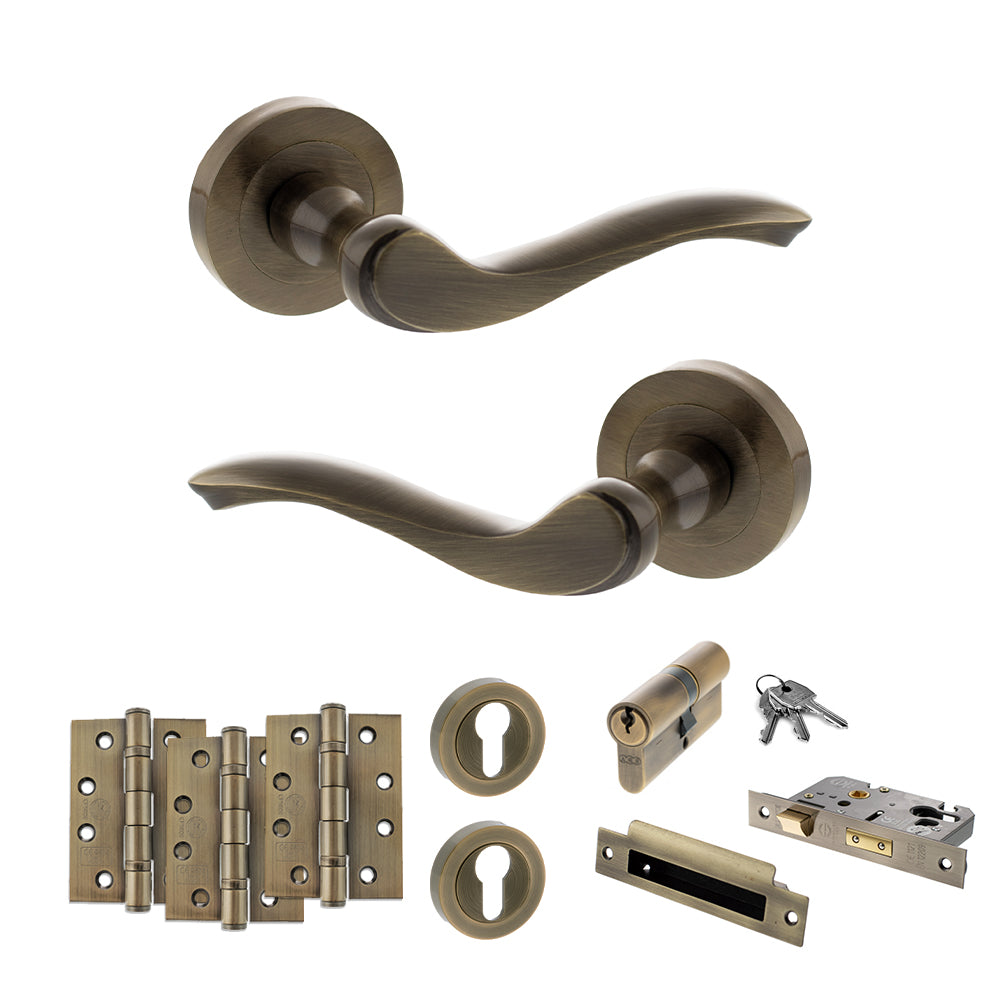 Quality image of Old English Warwick Door Handle Pack (Euro Lock Set - 3" CE Sashlock, 4" Fire Rated Hinges x3) - Antique Brass | Sku. adpoe178ab23 | available from Trade Door Handles.