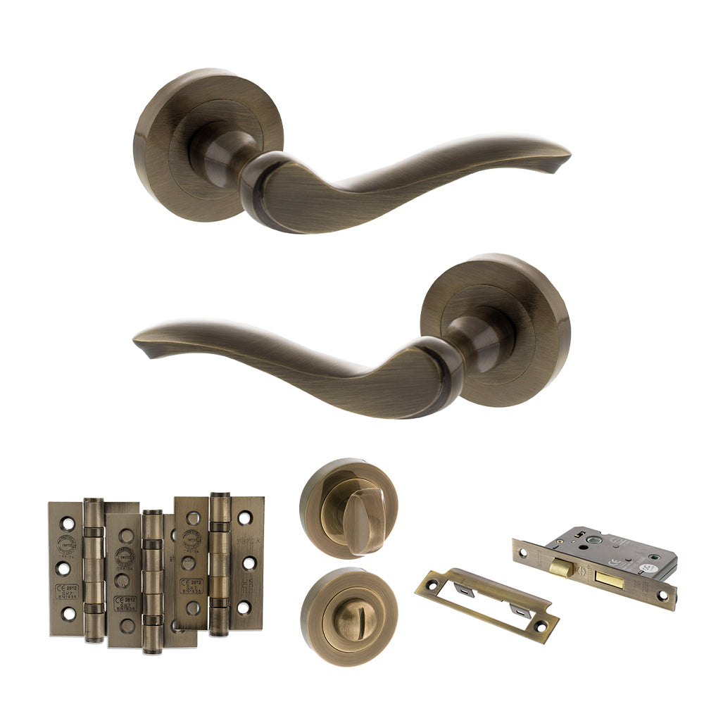 Quality image of Old English Warwick Door Handle Pack (Bathroom Set - 3" CE Bathroom Lock, 3" Fire Rated Hinges x3) - Antique Brass | Sku. adpoe178ab9 | available from Trade Door Handles.