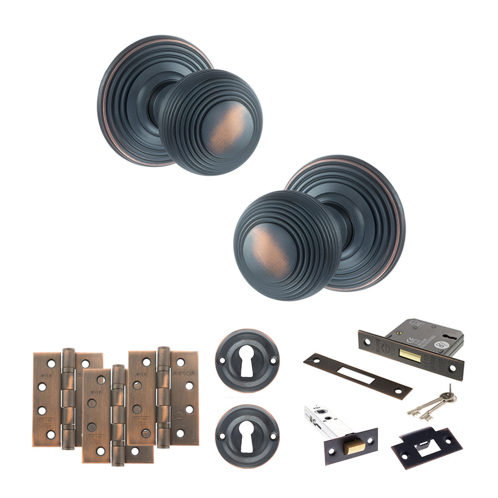 Quality image of Old English Ripon Door Knob Pack (Lock Set - 3" Latch & Deadlock, 4" Fire Rated Hinges x3) - Antique Copper | Sku. adpoe50rmkac67 | available from Trade Door Handles.