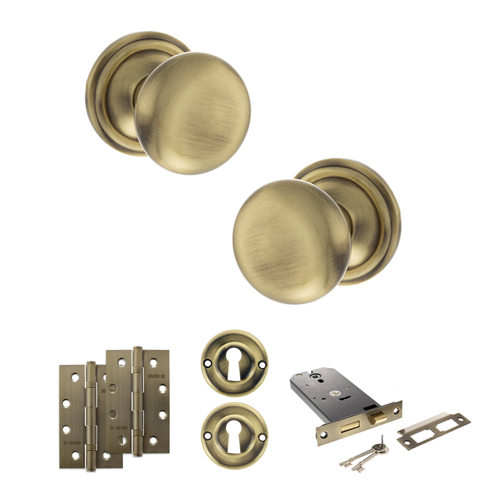 Quality image of Old English Harrogate Door Knob Pack (Lock Set - Horizontal Sashlock, 4" Slim Knuckle Hinges x2) - Antique Brass | Sku. adpoe58mmkab73 | available from Trade Door Handles.