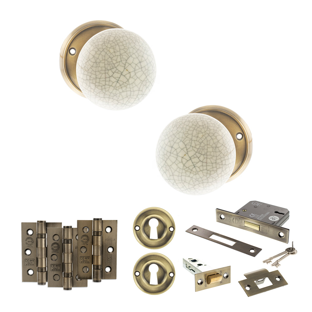 Quality image of Old English Skipton Door Knob Pack (Lock Set - 3" Latch & Deadlock, 3" Fire Rated Hinges x3) - Antique Brass | Sku. adpoe59cmkcab66 | available from Trade Door Handles.