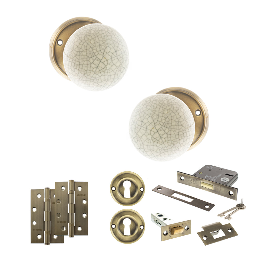 Quality image of Old English Skipton Door Knob Pack (Lock Set - 3" Latch & Deadlock, 4" Slim Knuckle Hinges x2) - Antique Brass | Sku. adpoe59cmkcab68 | available from Trade Door Handles.