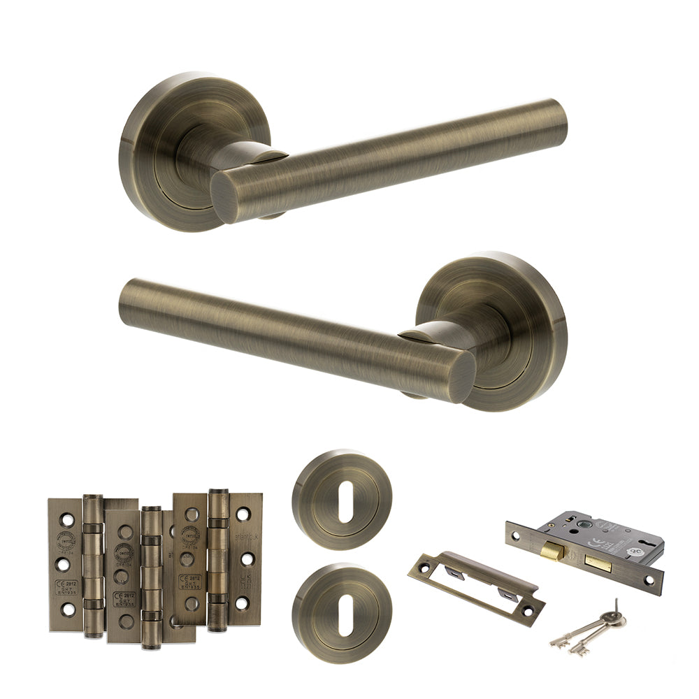 Quality image of STATUS Nebraska Door Handle Pack (3 Lever Lock Set - 3" CE Sashlock, 3" Fire Rated Hinges x3) - Antique Brass | Sku. adps28rab15 | available from Trade Door Handles.