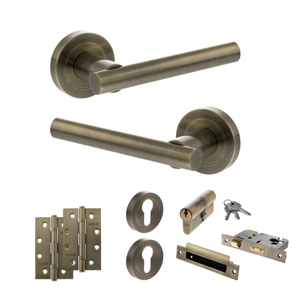 Quality image of STATUS Nebraska Door Handle Pack (Euro Lock Set - 3" CE Sashlock, 4" Slim Knuckle Hinges x2) - Antique Brass | Sku. adps28rab25 | available from Trade Door Handles.