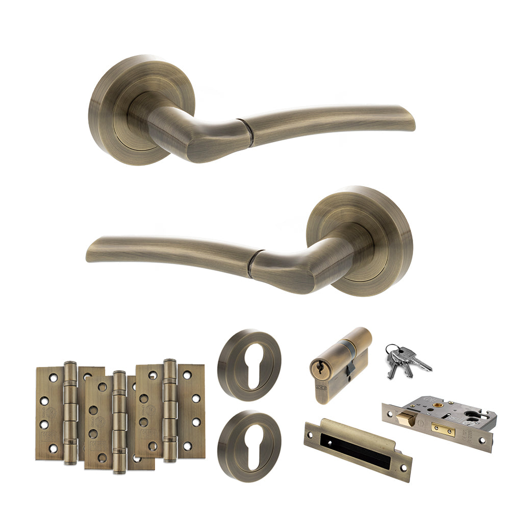 Quality image of STATUS Indiana Door Handle Pack (Euro Lock Set - 3" CE Sashlock, 4" Fire Rated Hinges x3) - Antique Brass | Sku. adps33rab23 | available from Trade Door Handles.