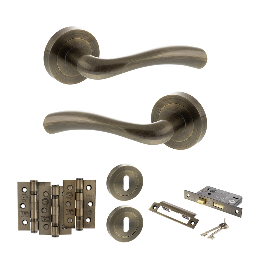 Quality image of STATUS Texas Door Handle Pack (3 Lever Lock Set - 2.5" CE Sashlock, 3" Fire Rated Hinges x3) - Antique Brass | Sku. adps35rab14 | available from Trade Door Handles.