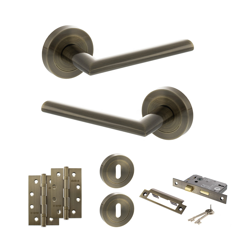 Quality image of STATUS Alabama Door Handle Pack (3 Lever Lock Set - 2.5" CE Sashlock, 4" Slim Knuckle Hinges x2) - Antique Brass | Sku. adps43rab18 | available from Trade Door Handles.