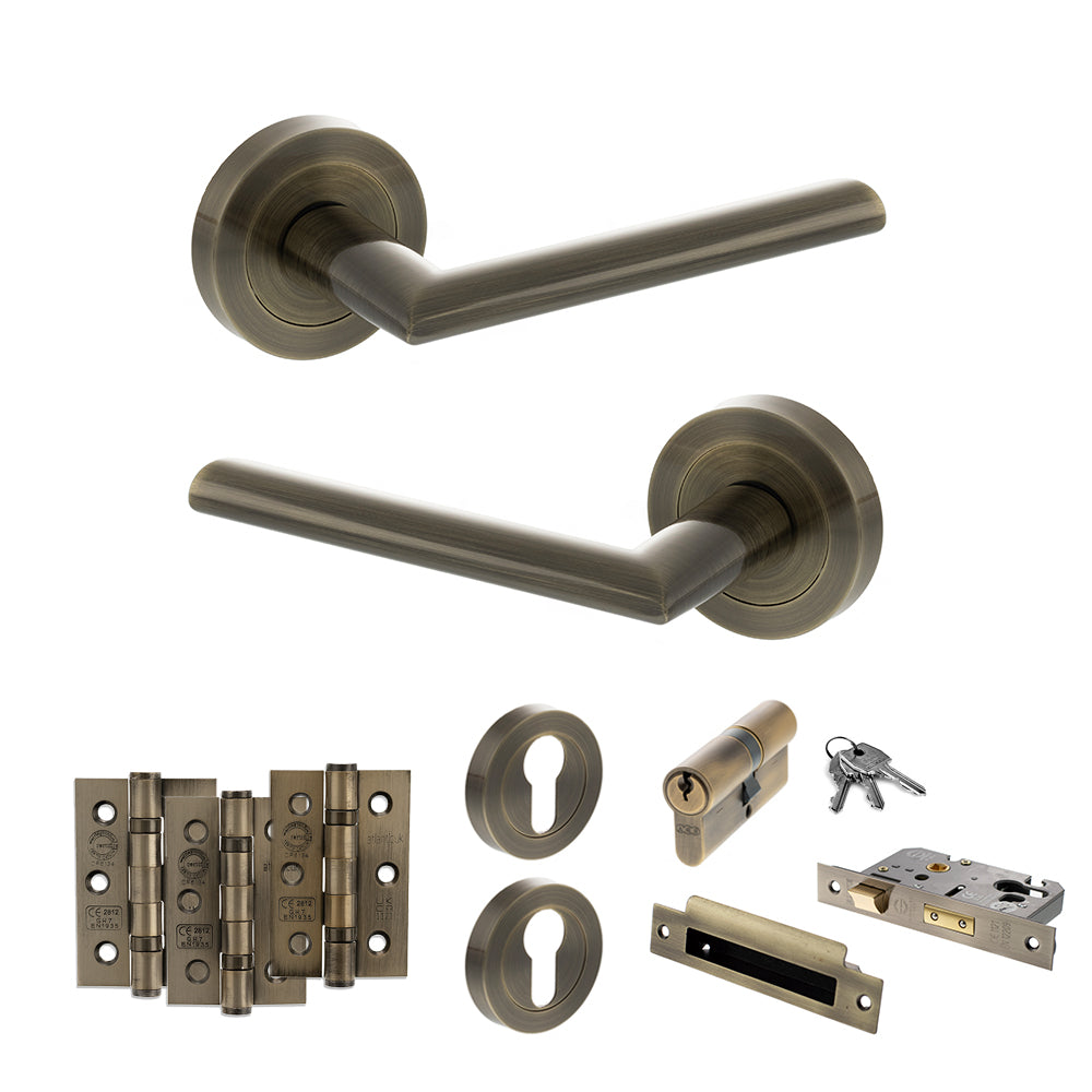 Quality image of STATUS Alabama Door Handle Pack (Euro Lock Set - 3" CE Sashlock, 3" Fire Rated Hinges x3) - Antique Brass | Sku. adps43rab21 | available from Trade Door Handles.
