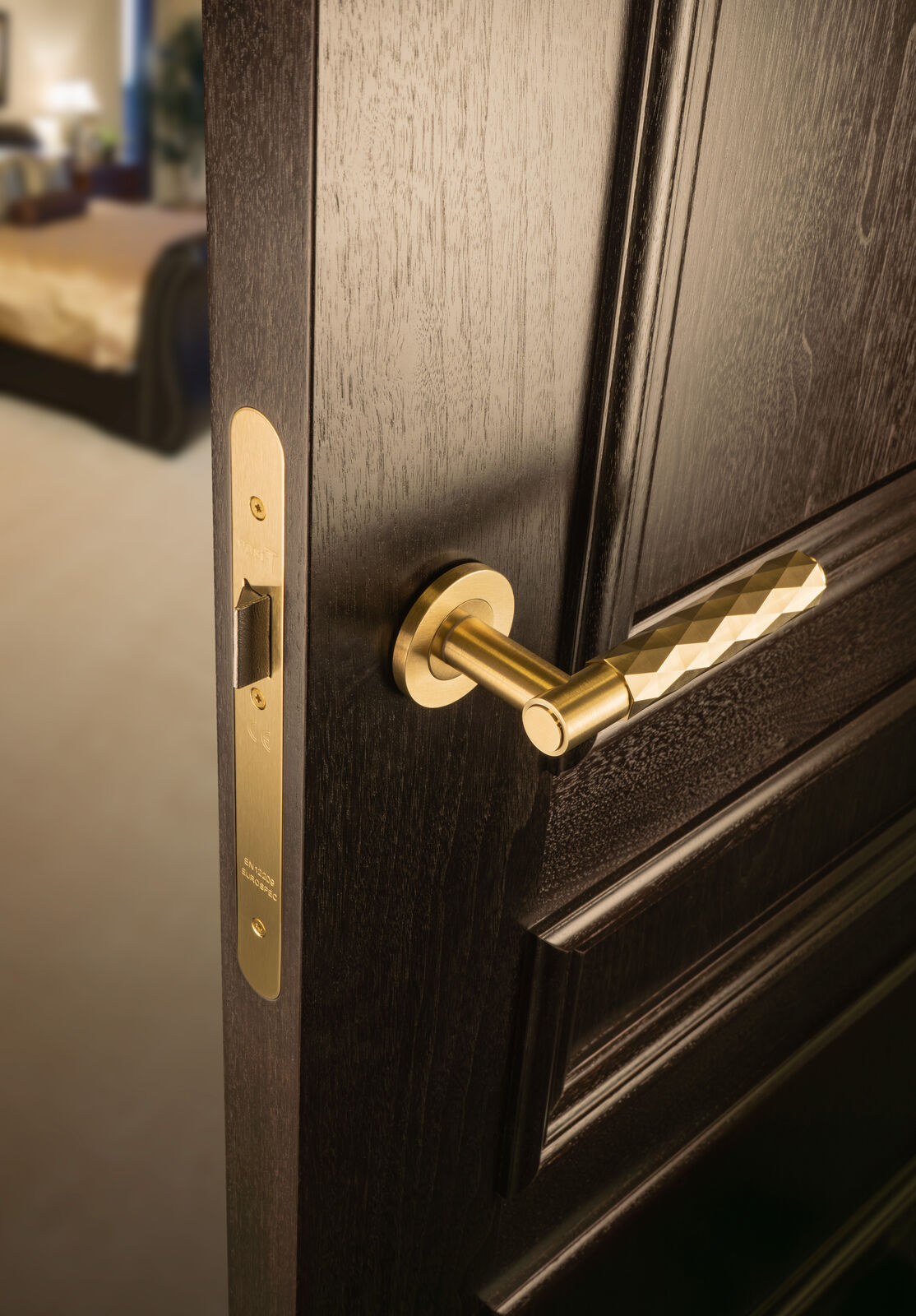 This is an image showing Alexander & Wilks Spitfire Diamond Cut Lever on Round Rose - Satin Brass PVD - aw226-SBPVD available to order from Trade Door Handles in Kendal, quick delivery and discounted prices.