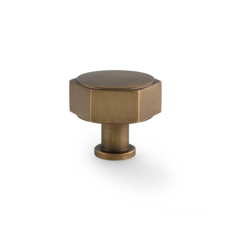 This is an image showing Alexander & Wilks - Vesper Hex Cabinet Knob - Antique Brass aw828-40-ab available to order from Trade Door Handles in Kendal, quick delivery and discounted prices.