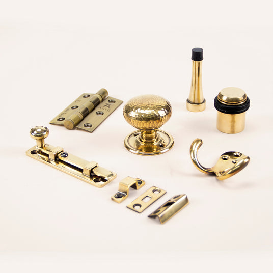 Image showing a selection of Ironmongery in an Aged Brass finish.  Available to order from Trade Door Handles in Kendal