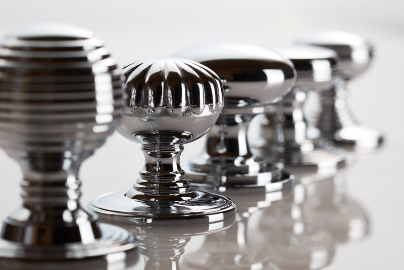 Image showing a range of Kitchen and Cabinet Knobs in Polished Chrome in a line from Fingertip Design. Available to order from Trade Door Handles