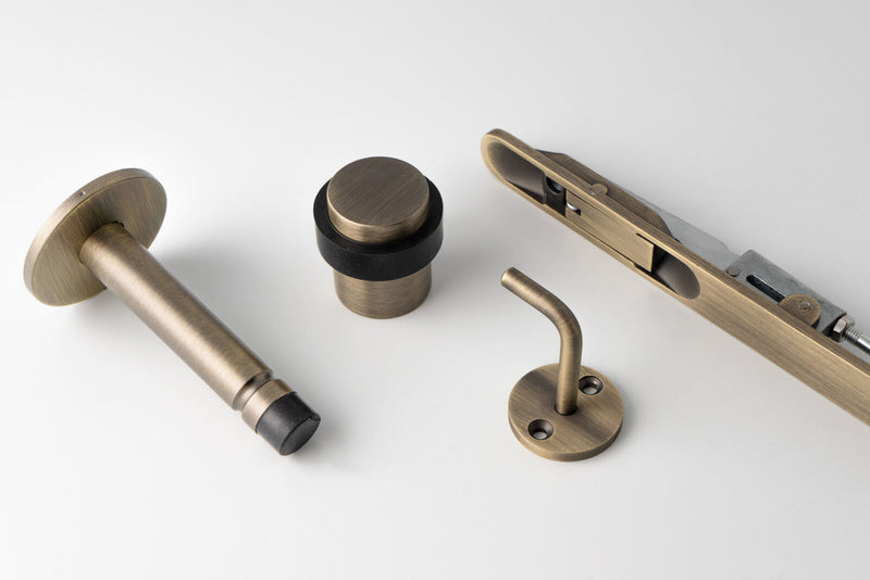 Carlisle Brass Antique Brass Accessories including Door Stops, Hooks and Bolts