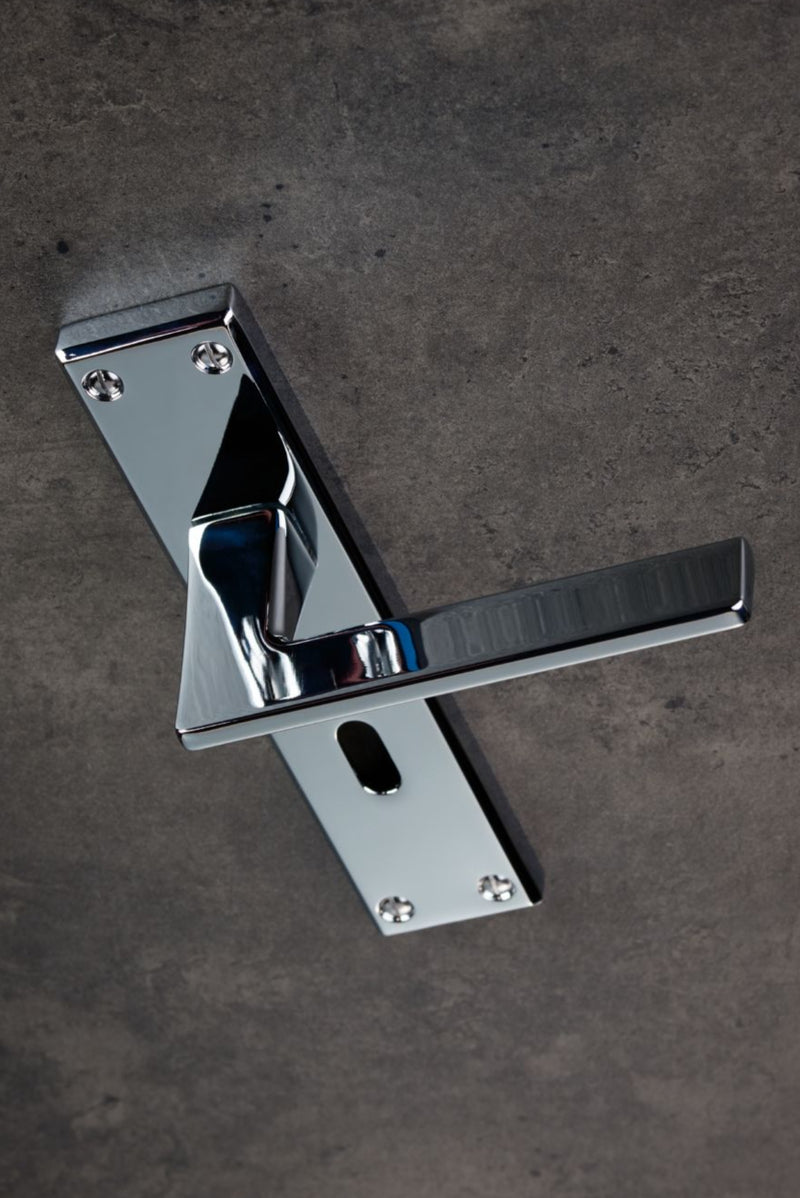 Carlisle Brass Locking Door Handles on a backplate Polished Chrome SZM034SC
