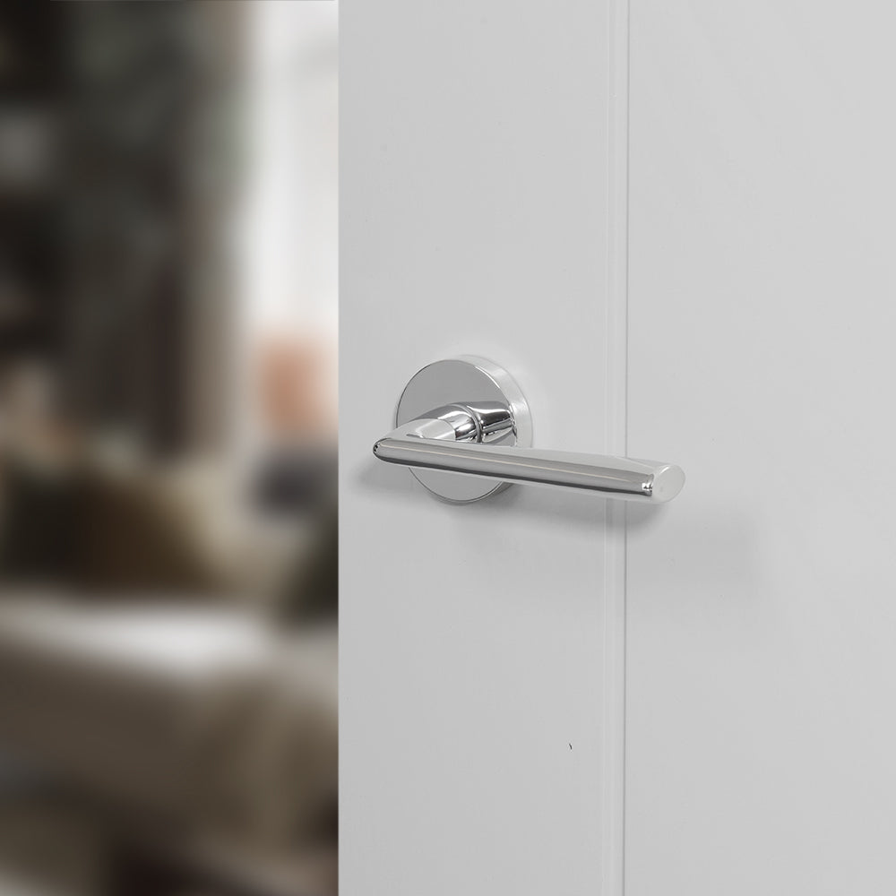 Quality image of Forme Milly Lever Door Handle on Minimal Round Rose - Polished Chrome | Sku. fmr133pc | available from Trade Door Handles.