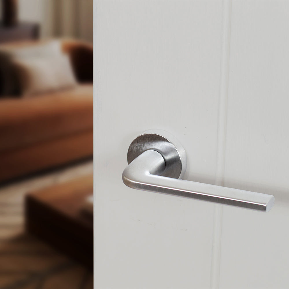 Quality image of Forme Milly Lever Door Handle on Minimal Round Rose - Satin Chrome | Sku. fmr133sc | available from Trade Door Handles.