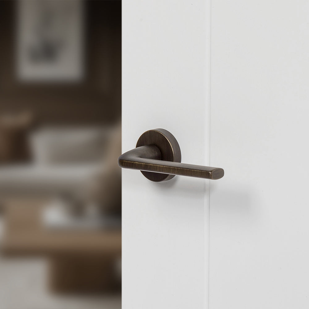 Quality image of Forme Milly Lever Door Handle on Minimal Round Rose - Urban Bronze | Sku. fmr133ub | available from Trade Door Handles.