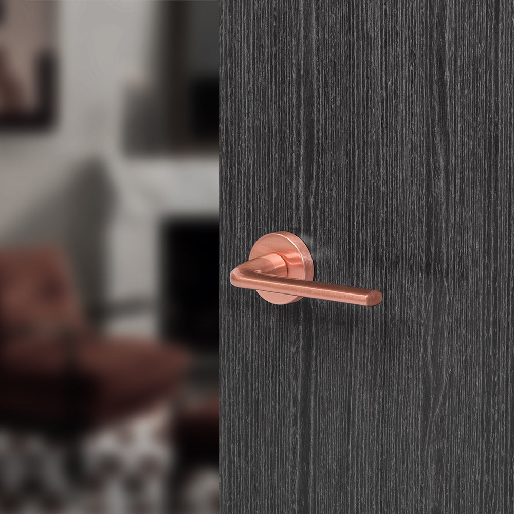 Quality image of Forme Milly Lever Door Handle on Minimal Round Rose - Urban Satin Copper | Sku. fmr133usc | available from Trade Door Handles.