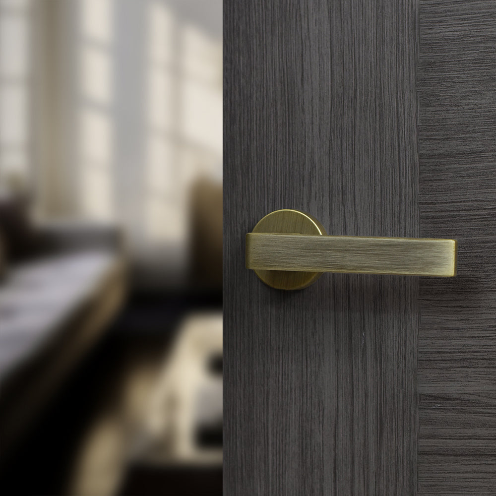 Quality image of Forme Asti Lever Door Handle on Minimal Round Rose - Yester Bronze | Sku. fmr254yb | available from Trade Door Handles.
