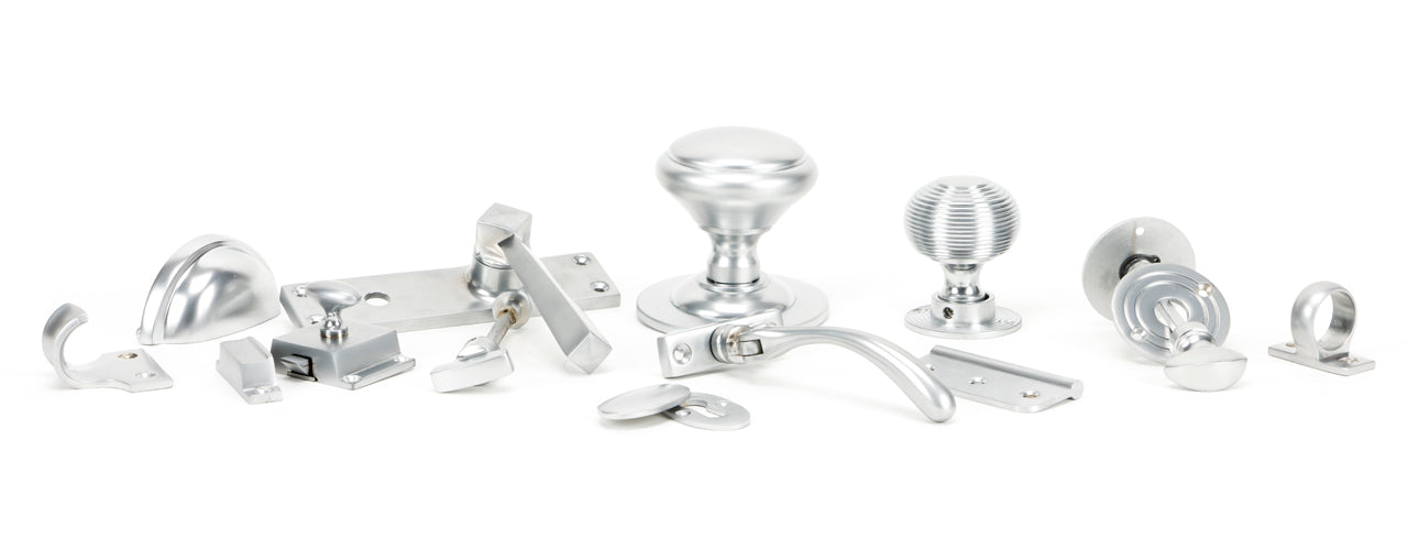 Image showing a range of From The Anvil Ironmongery and Hardware in Satin Chrome.  Available to order from Trade Door Handles in Kendal
