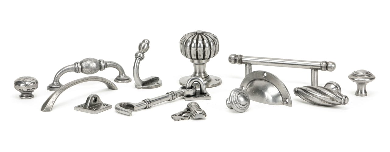 Image showing a range of From The Anvil Natural Smooth Ironmongery. Available to order from Trade Door Handles in Kendal