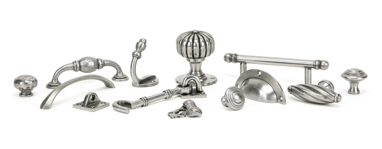 Image showing a range of From The Anvil Natural Smooth Ironmongery.  Available to order from Trade Door Handles in Kendal