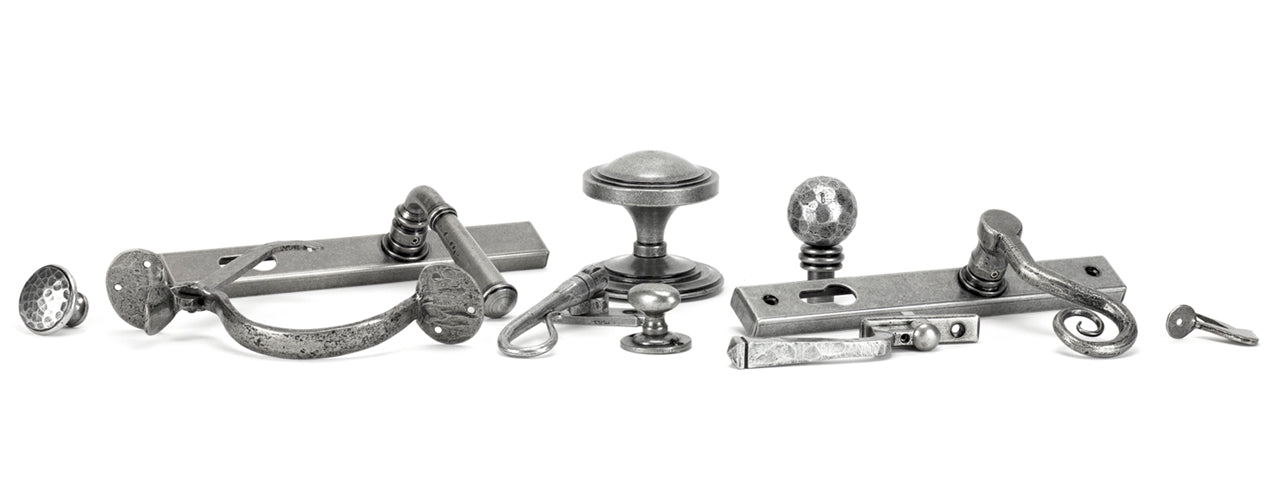Image showing a range by From The Anvil Pewter Patina door hardware, window furniture and cabinet hardware.  Available to order from Trade Door Handles in Kendal