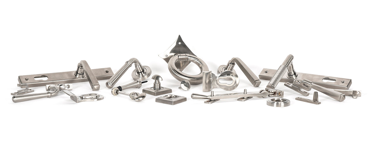 Image showing a range of From The Anvil Ironmongery and Hardware in Marine Grade 316 Satin Stainless Steel.  Available to order from Trade Door Handles in Kendal