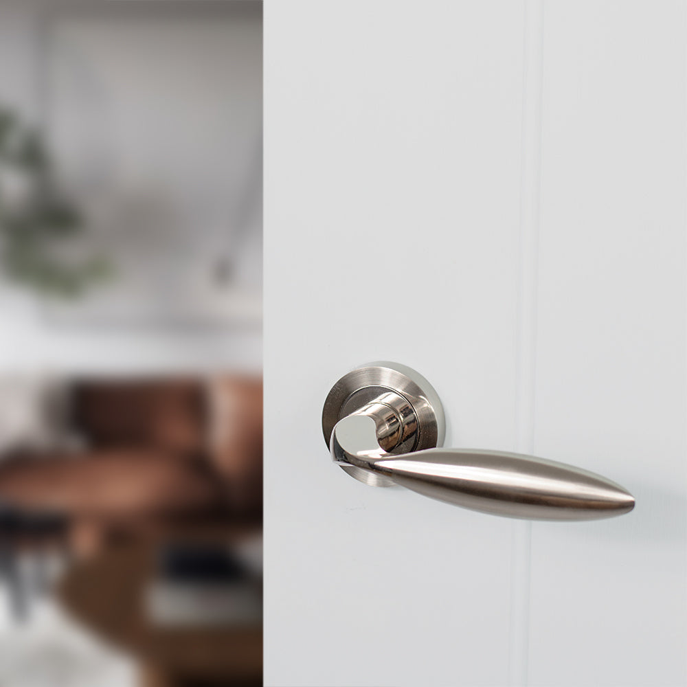 Quality image of Mediterranean Ibiza Lever Door Handle on Round Rose - Satin Nickel/Polished Nickel | Sku. m46snnp | available from Trade Door Handles.