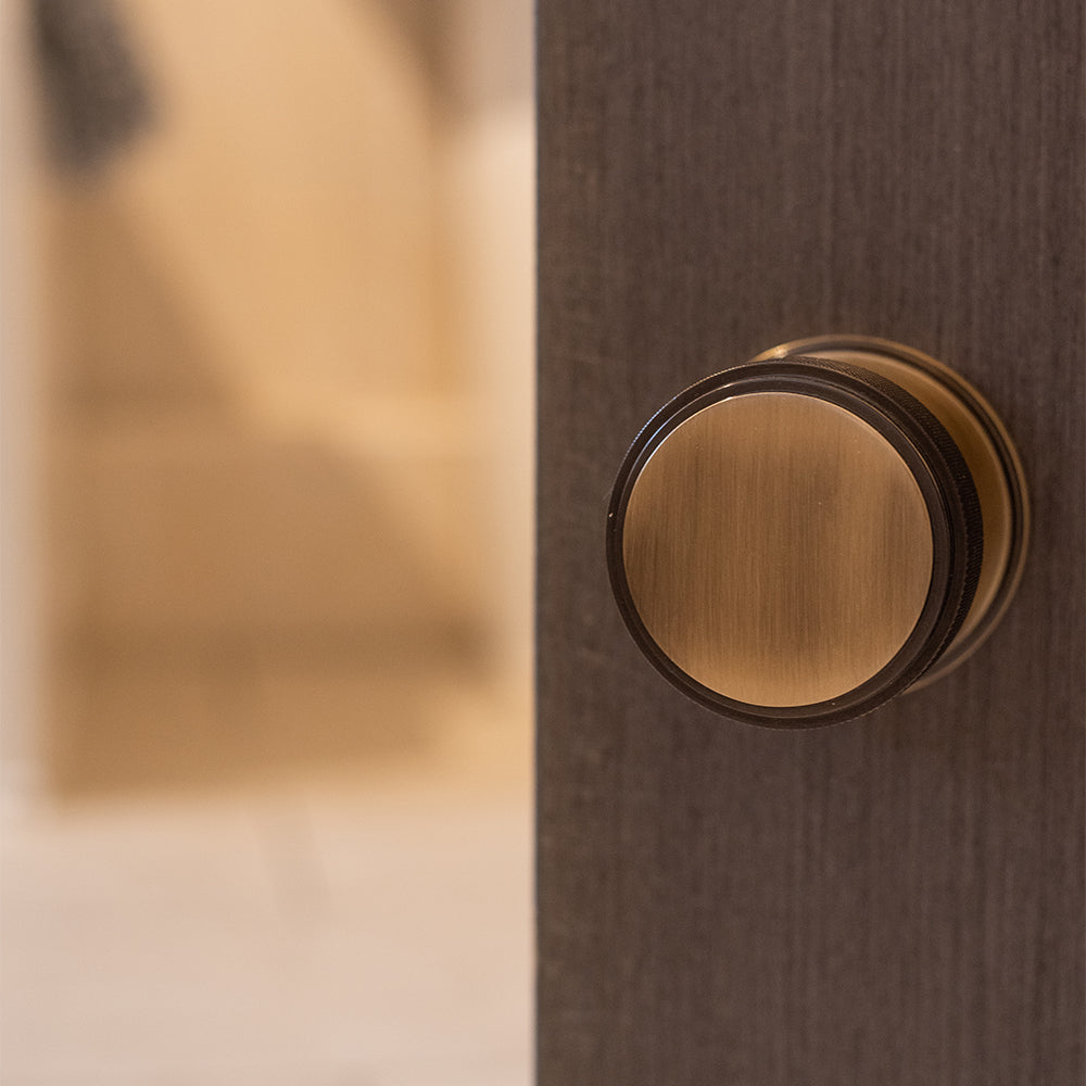 Quality image of Millhouse Brass Harrison Brass Knurled Mortice Knob on Concealed Fix Rose - Antique Brass | Sku. mh450ksmkab | available from Trade Door Handles.