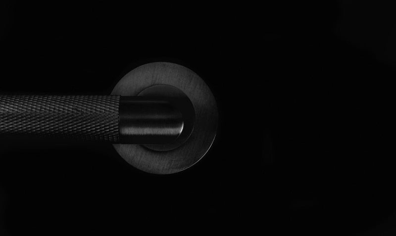 Close-up of a Matt Black Door Handle By Alexander and Wilks