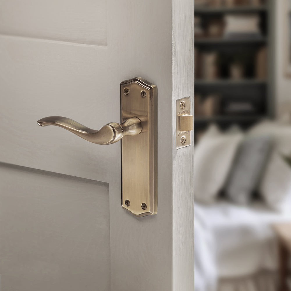 Quality image of Old English Warwick Latch Lever Door Handle on Backplate - Antique Brass | Sku. oe178lab | available from Trade Door Handles.
