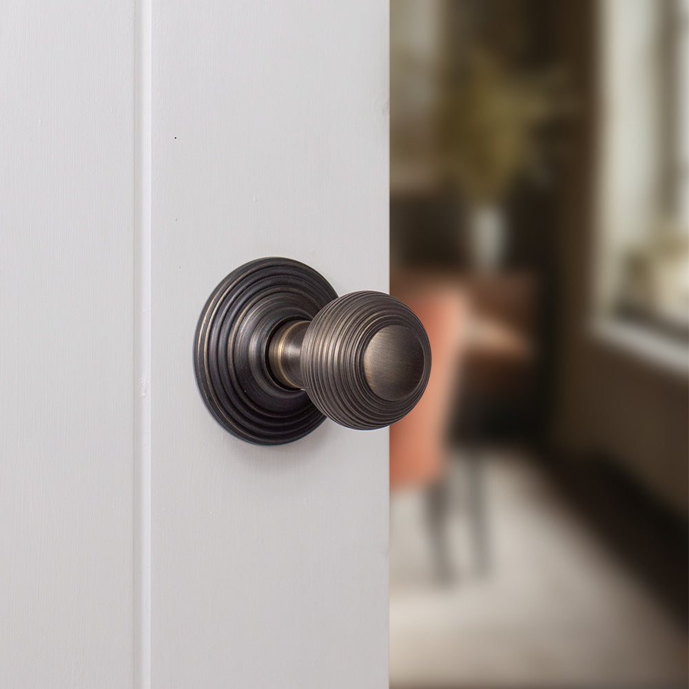 Quality image of Old English Ripon Solid Brass Reeded Mortice Knob on Concealed Fix Rose - Urban Bronze | Sku. oe50rmkub | available from Trade Door Handles.